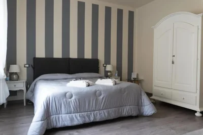 Chambre Double Deluxe avec Lit d’Appoint — Madame Pucci